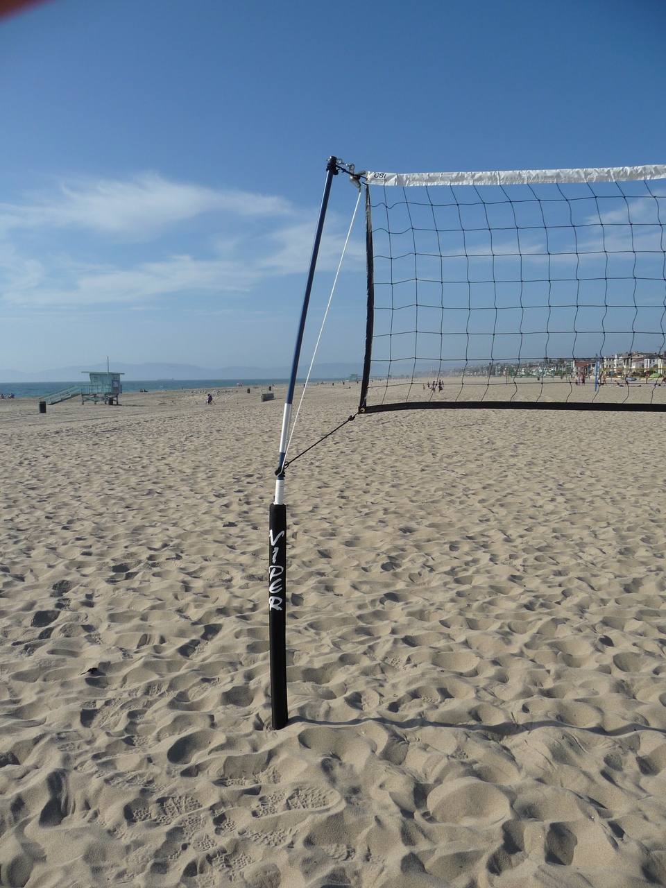 Rope holding up volleyball net.